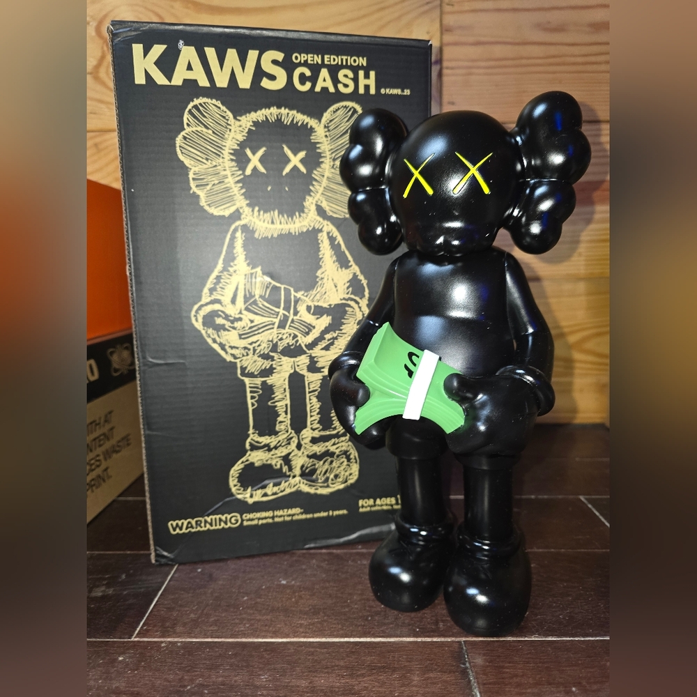 Kaws counting money figure